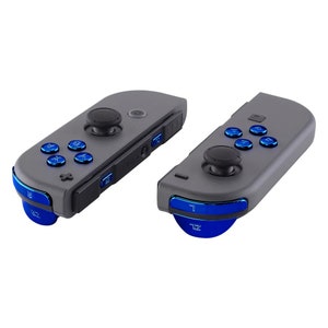 May include: Two gray Nintendo Switch Joy-Con controllers with blue accents. The controllers have a black analog stick and face buttons. The buttons are labeled A, B, X, Y, and L and R.