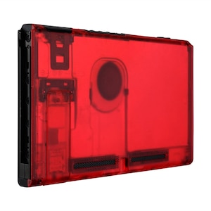 May include: A red transparent case for a Nintendo Switch console. The case has a black border and a clear back panel.