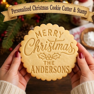 May include: A round, scalloped-edge cookie featuring the embossed text Merry Christmas, the word THE, and the name THE ANDERSONS, with a holly leaf and berry design in the center. A banner at the top displays the text Personalized Christmas Cookie Cutter & Stamp.