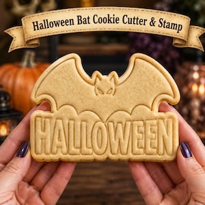 May include: A beige cookie cutter and stamp shaped like a bat with the word HALLOWEEN embossed in capital letters across the bottom. The tool features a detailed bat silhouette with pointed ears and wings, designed for creating festive baked goods.