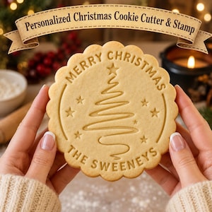 May include: A round, scalloped-edge cookie featuring an embossed design of a stylized Christmas tree, stars, and the text "MERRY CHRISTMAS" and "THE SWEENEYS". A banner at the top of the image displays the text "Personalized Christmas Cookie Cutter & Stamp".