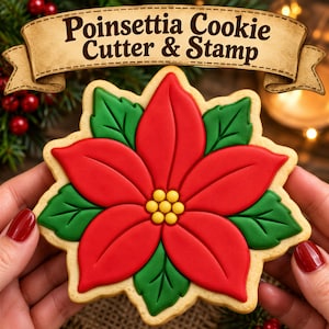 May include: A Poinsettia Cookie Cutter & Stamp featuring a red and green floral design with yellow centre details. The cookie is shaped like a poinsettia flower with distinct red petals and green leaves, presented with a decorative banner above.