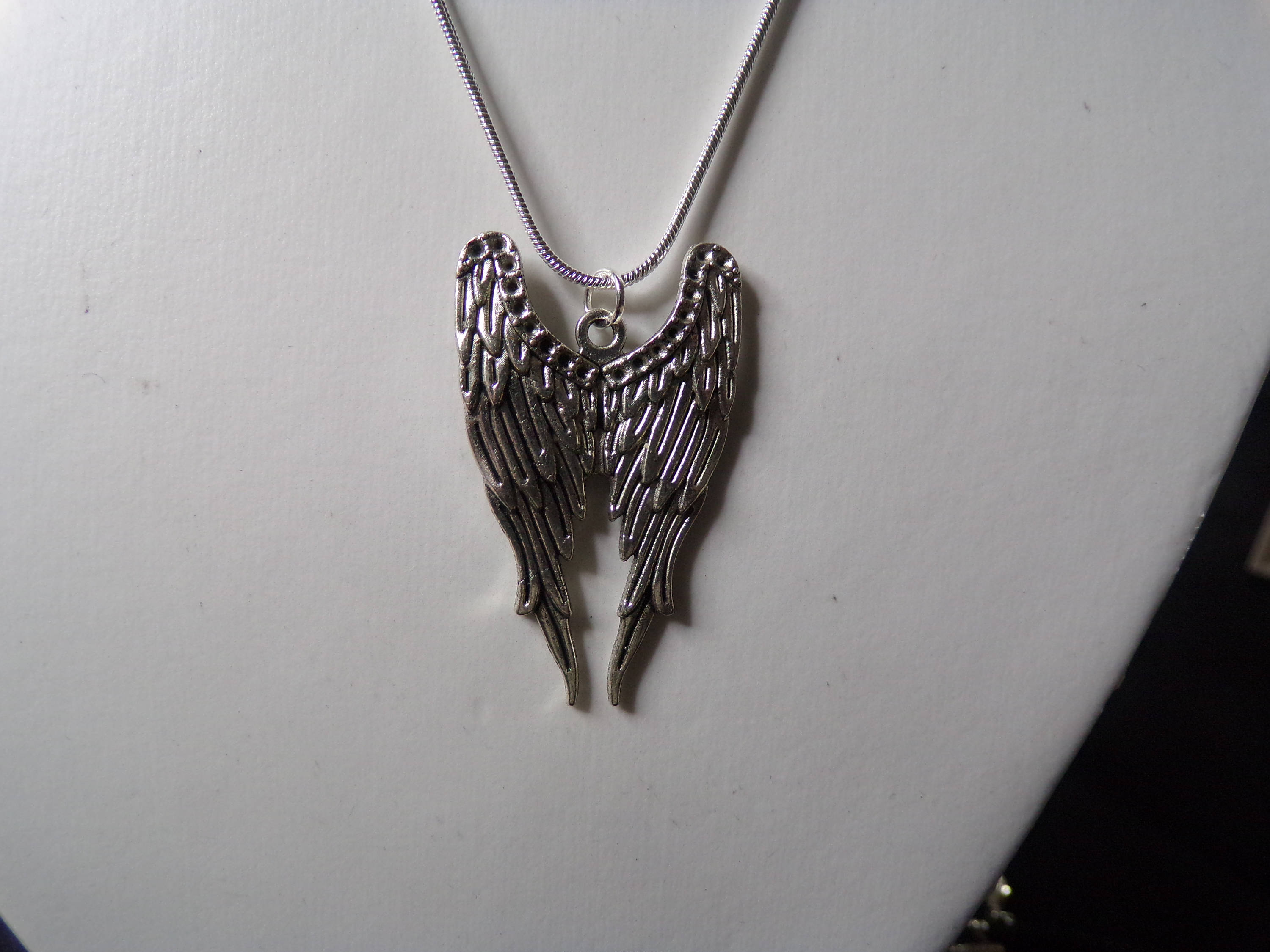 Folded angel wing necklace