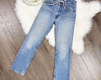 XS/25 Vintage años 80 509 Lavado medio claro Etiqueta naranja Corte ajustado Pierna recta Levis