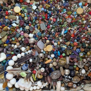 May include: A set of three ceramic mugs with a speckled, matte finish. The mugs are in shades of cream, light brown, and dark brown. Each mug has a simple, minimalist design, perfect for coffee or tea.