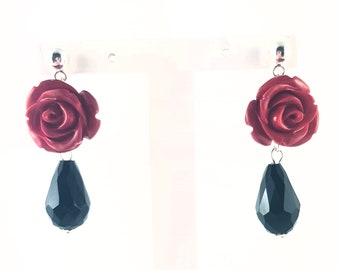 Red rose earrings with faceted glass teardrops.