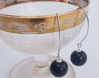 Onyx drop earrings on long sterling silver hooks.