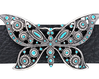 May include: A silver butterfly belt buckle with turquoise accents. The buckle is detailed with intricate filigree and has a cutout design.