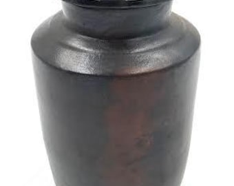 May include: A dark brown ceramic jar with a wooden lid. The lid has a small metal knob.