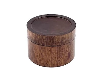 May include: A round wooden box with a dark brown finish. The box has a smooth, polished surface and a lid that fits snugly on top.