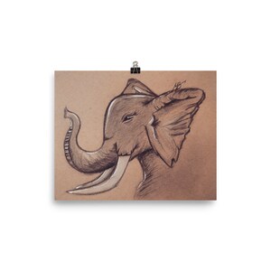 May include: A black and white pencil drawing of an elephant's head on a brown paper background. The elephant's trunk is raised and its ears are spread out.