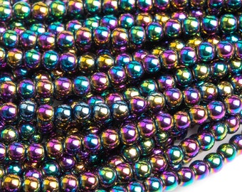May include: A strand of iridescent black hematite beads. The beads are round and have a smooth, shiny finish. The beads are strung on a clear thread.