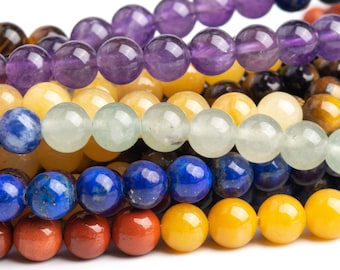 May include: A close-up of a multi-colored beaded bracelet with seven different colors of beads. The beads are round and smooth, and they are arranged in a pattern of seven colors. The colors are purple, yellow, green, blue, dark blue, orange, and red.