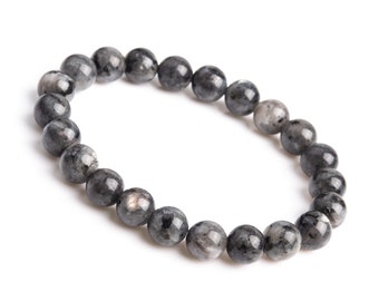 Könnte beinhalten: Ein schwarzes Armband aus runden, polierten Steinen. Das Armband ist aus natürlichen Materialien gefertigt und hat ein schlichtes, elegantes Design.