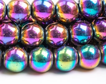May include: A strand of iridescent rainbow hematite beads. The beads are round and have a smooth, polished finish. The beads are strung on a clear elastic cord.