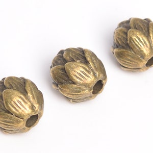 10 cuentas espaciadoras de loto de latón antiguo de 9 mm (64260-2482)