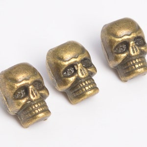 20 Pcs - 10x8MM Antique Brass Skull Spacer Beads (64282-2483)