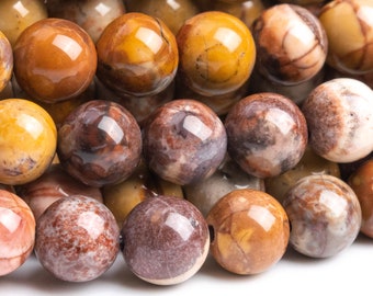 May include: A strand of round, brown, yellow, and white jasper beads. The beads have a mottled, marbled appearance.