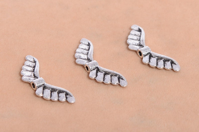 8Pcs Antiqued Silver Tone Hollow Wings Spacer Beads Charms 8x32mm 8Pcs Antiqued Silver Tone Hollow Wings Spacer Beads Charms 8x32mm