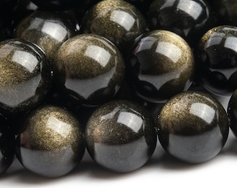 May include: Close-up of a collection of polished, round golden obsidian beads. The beads have a glossy, reflective surface with a mix of black and gold colors. The beads are likely used for jewelry making.