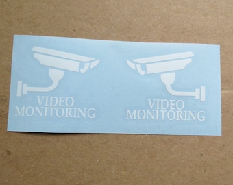 Set med 2 vinyldekaler för videoövervakningskamera