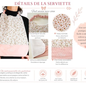 May include: A floral print bib with a pink textured bottom panel featuring the name Aria embroidered in white. The bib includes an elastic neck strap, a soft absorbent lining, and measures 35 cm by 40 cm. Text includes D&Eacute;TAILS DE LA SERVIETTE.