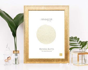 May include: A framed print with a gold frame and a white background. The print features a gold spiral design with the text "Ratana Sutta The Jewel Discourse" in black.
