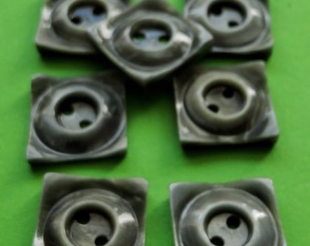 Vintage set of nine 1930's small grey buttons.