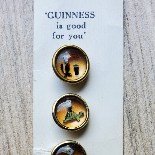 Vintage set of six 1950's Guinness promotional buttons.
