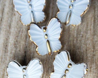 Vintage set of five glass butterfly buttons.