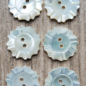 Vintage set of six engraved natural mother of pearl buttons.