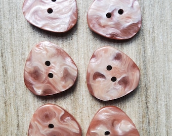 Vintage set of six marbled pink jacket buttons.