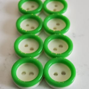 Vintage set of eight little green and white buttons.