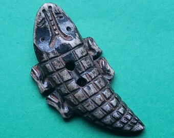 Hand crafted buffalo bone button of lizard.