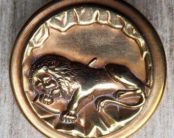 Vintage large brass Lion of Lucerne button.