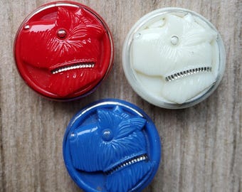 Vintage collection of three large glass scottie dog buttons.