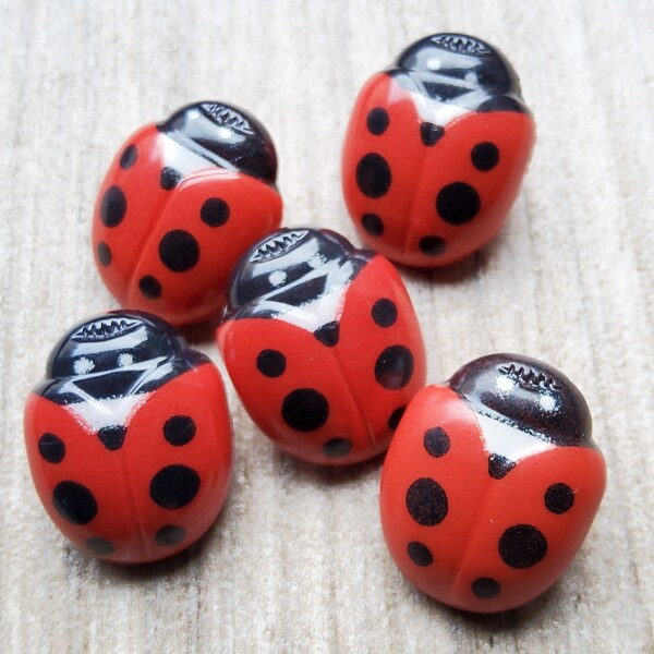 Vintage set of five 1970's ladybird buttons.