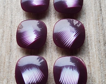 Vintage set of six acrylic purple coat buttons.