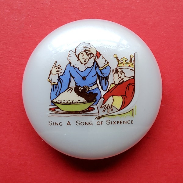 Vintage nursery rhyme button 'Sing a song of sixpence'.