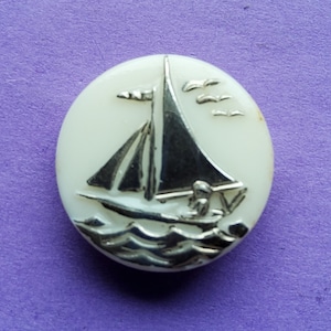 Vintage Art Deco glass sailing boat buttons.