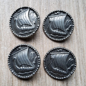 Vintage set of four pewter Viking longship buttons.