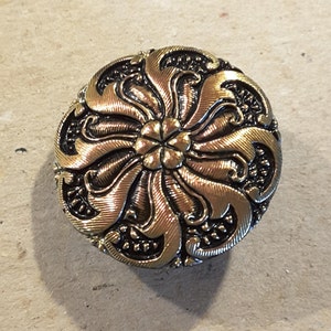 Czech glass button wheel design irrededesent finish.
