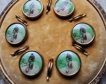 Vintage British boxed set of Edwardian cycling waistcoat buttons.