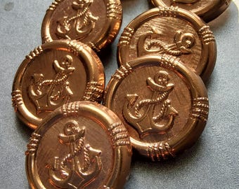 Vintage set of seven metal anchor coat buttons.