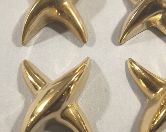Vintage set of 4 metalized plastic star buttons (gold or silver.)