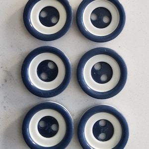 Vintage 1950's set of six blue and white plastic buttons.