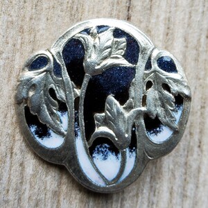 Vintage Art Nouveau style enamel button.