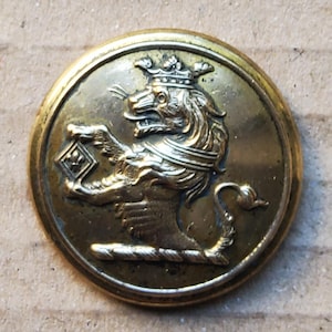 J.Platt-knop met grote messing leeuwenkleur begin 1900.