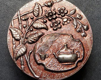 Botão de metal francês vintage grande do início de 1900.