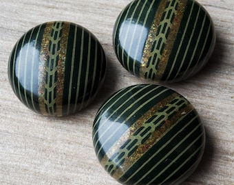Vintage trio of large 1920-30's metal and celluloid buttons.